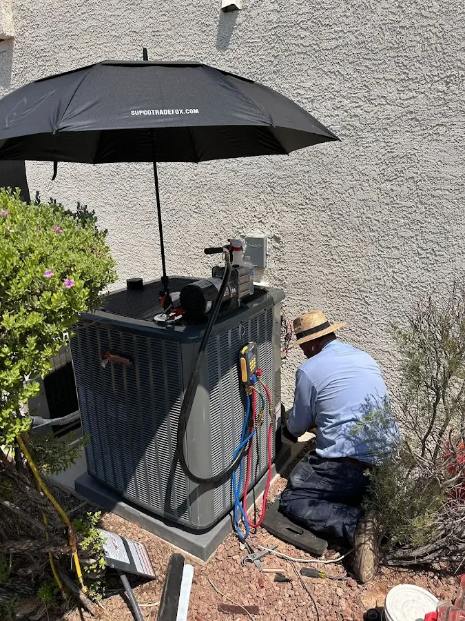 HVAC technician performing outdoor AC maintenance in Rockledge